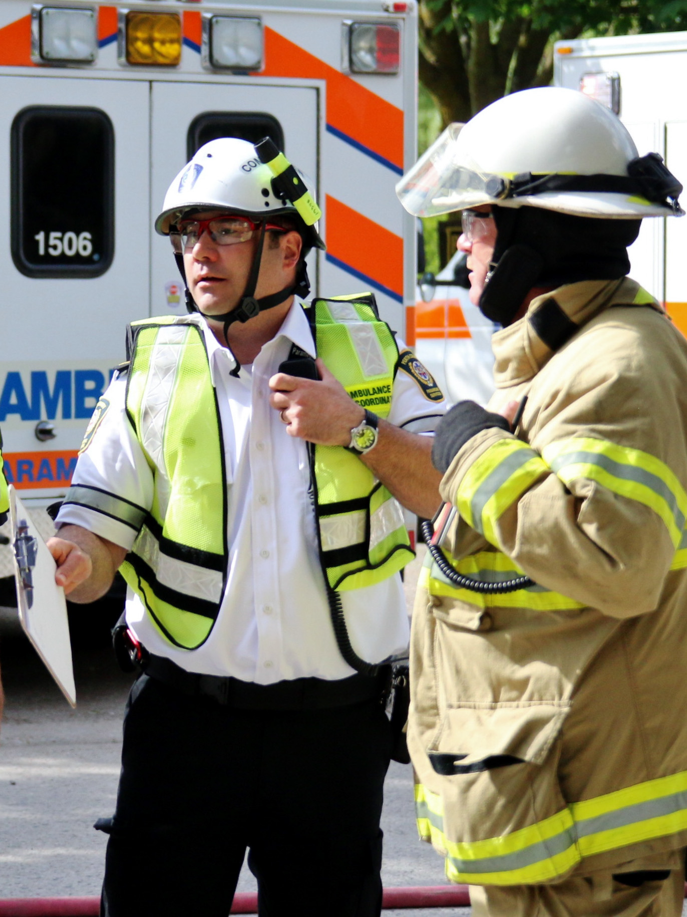 Firefighters talking on the street