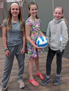 Three girls and soccer ball