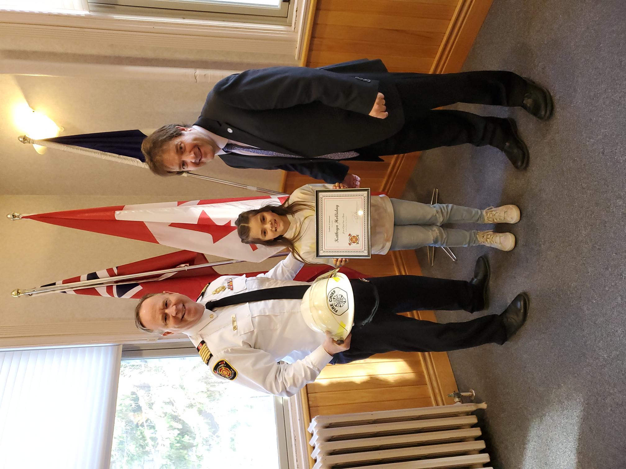 (1) From left to right, St. Marys Fire Chief Richard “Andy” Anderson, Kathryn Holliday and Mayor Al Strathdee at St. Marys Town Hall