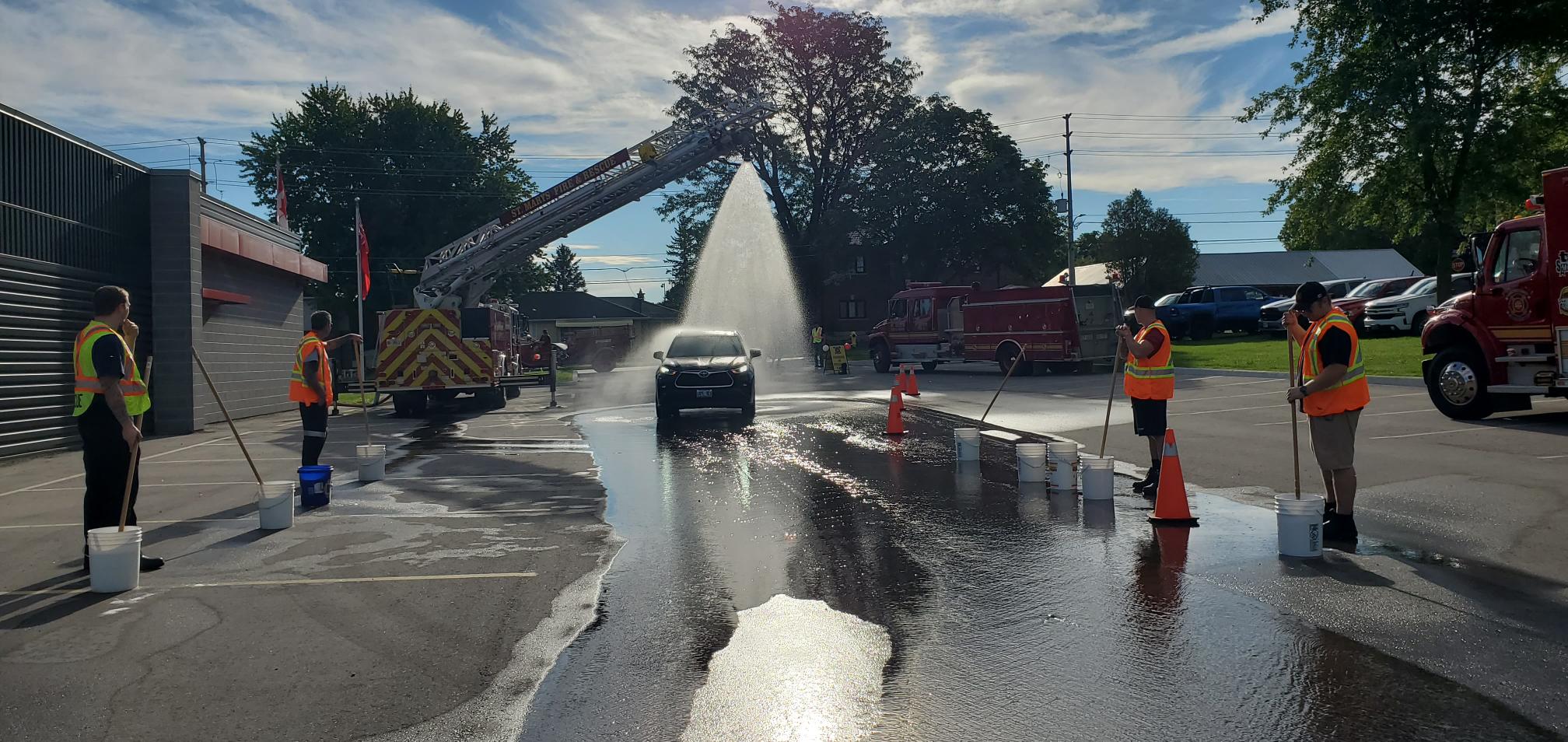 The St. Marys Fire Department firefighters eagerly await their first customer of the day for their first annual car wash fundraising event.