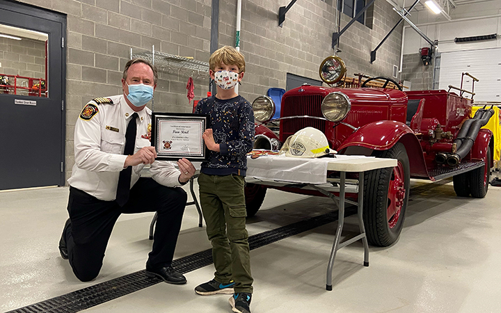 (1) From left to right: St. Marys Fire Chief Richard “Andy” Anderson and “Fire Chief Experience” winner Finn Reid. 