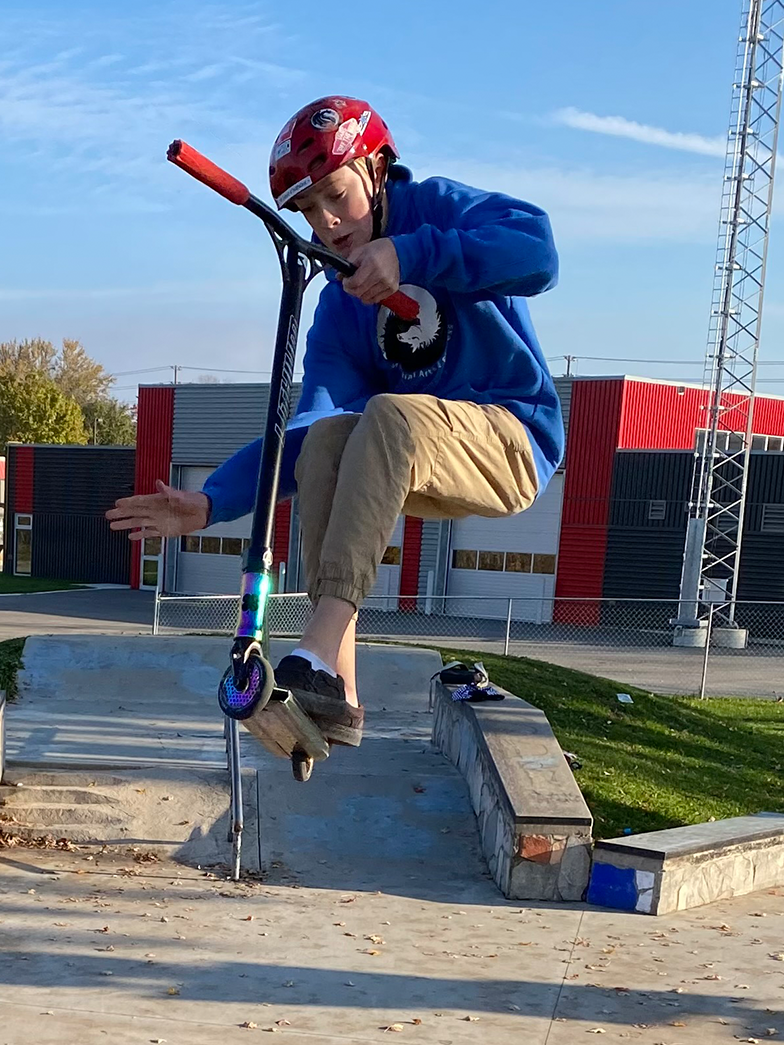 Child doing trick at skatepark