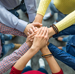 Group of people with joined hands
